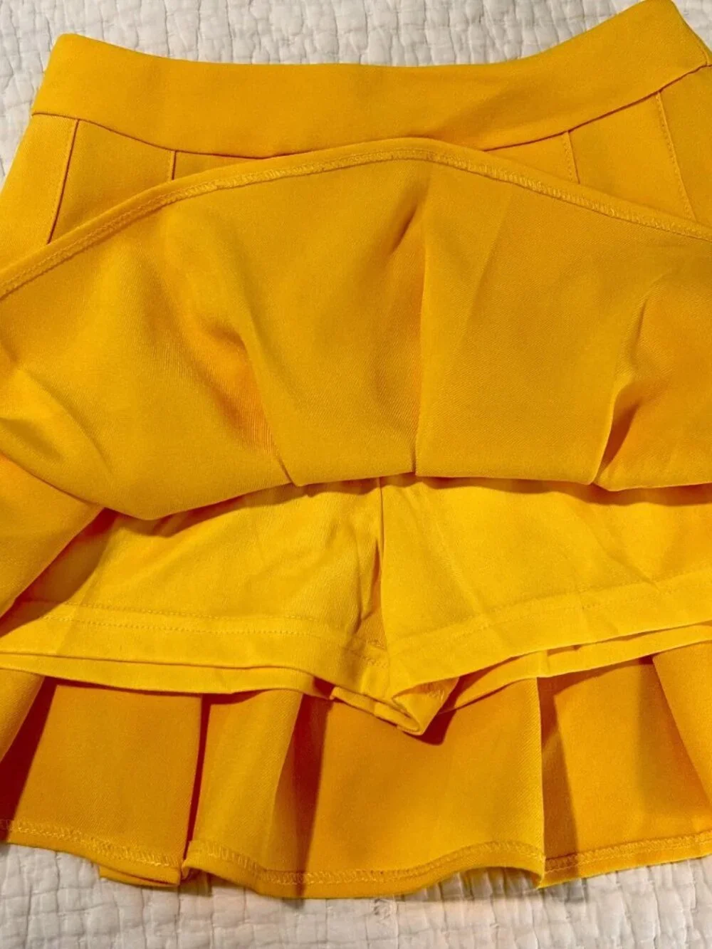 Source Unknown pleated yellow
